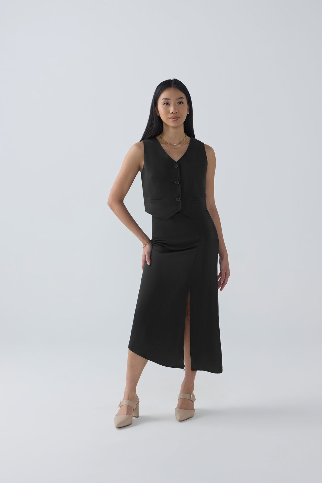 AFYA PETITE Nora black cupro asymmetrical midi skirt – front view, side slit for petite women under 165cm